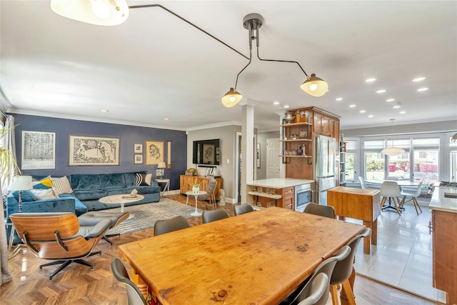 dining area with ornamental molding, recessed lighting, baseboards, and ornate columns
