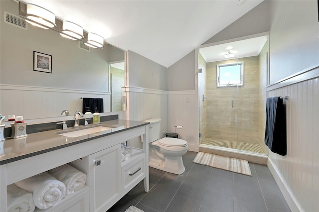 full bathroom with toilet, wainscoting, visible vents, a shower stall, and tile patterned floors