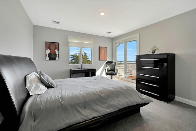 bedroom featuring baseboards, visible vents, carpet floors, and access to exterior
