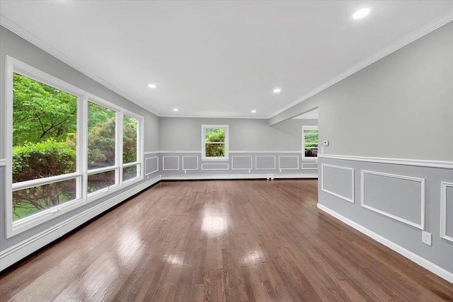 83 Sherwood Rd, Cortlandt Manor, NY 10567 - unfurnished room with wainscoting, wood finished floors, a baseboard heating unit, ornamental molding, and recessed lighting