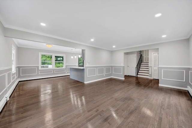 83 Sherwood Rd, Cortlandt Manor, NY 10567 - unfurnished living room featuring a decorative wall, stairs, wainscoting, recessed lighting, and dark wood-style floors