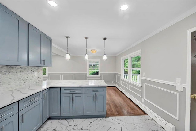 83 Sherwood Rd, Cortlandt Manor, NY 10567 - kitchen featuring a peninsula, light marble finish flooring, crown molding, light stone counters, and wainscoting