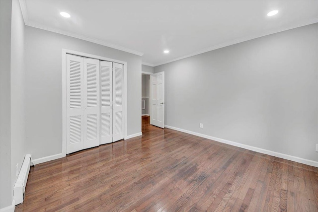 83 Sherwood Rd, Cortlandt Manor, NY 10567 - unfurnished bedroom featuring baseboard heating, wood finished floors, crown molding, recessed lighting, and baseboards