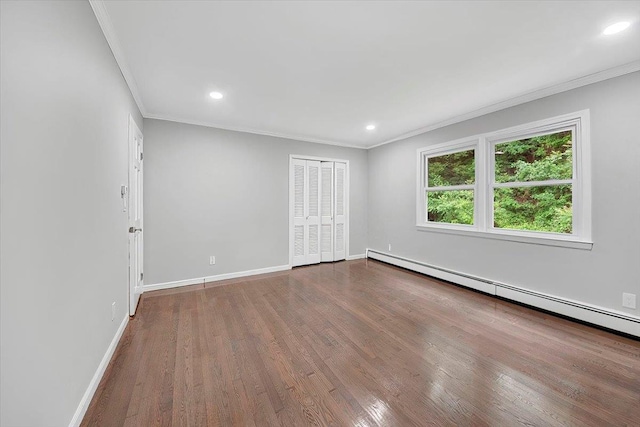 83 Sherwood Rd, Cortlandt Manor, NY 10567 - spare room featuring a baseboard radiator, crown molding, wood finished floors, baseboards, and recessed lighting