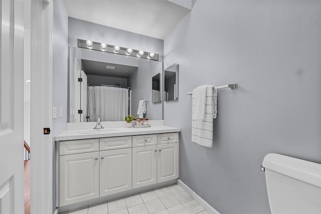 full bathroom with toilet, curtained shower, baseboards, tile patterned flooring, and vanity
