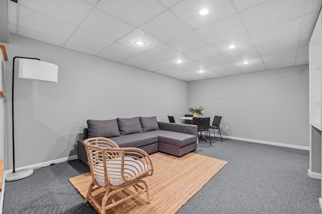 carpeted living area with baseboards and recessed lighting