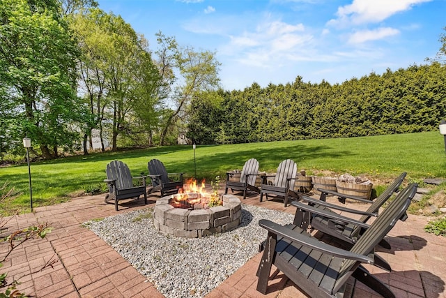 view of patio with a fire pit