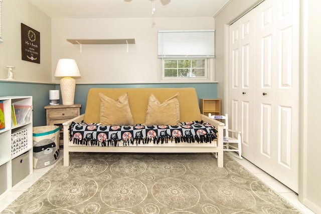 tiled bedroom with a closet