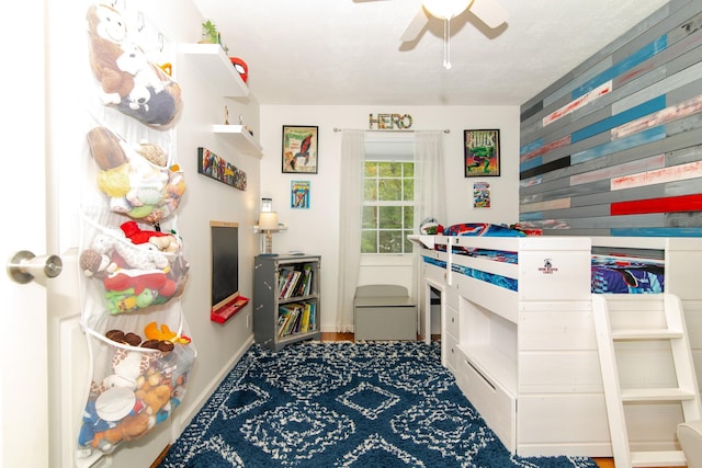 bedroom featuring baseboards and a ceiling fan
