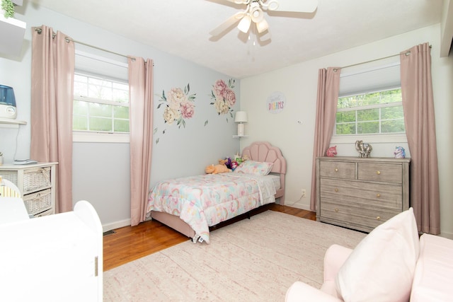 bedroom with wood finished floors and ceiling fan