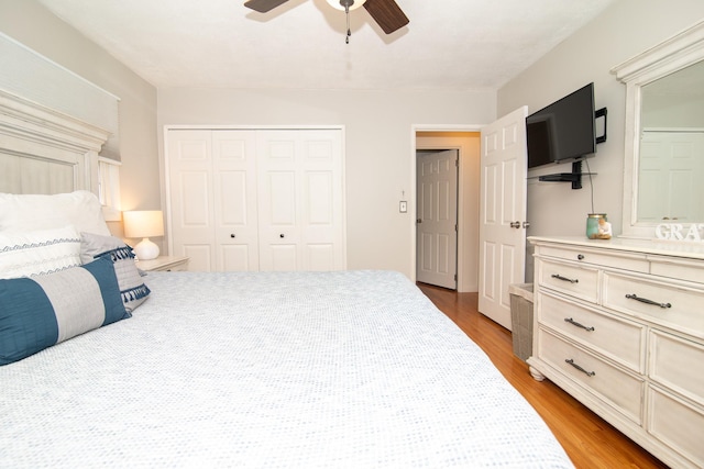 bedroom with light wood-type flooring and ceiling fan