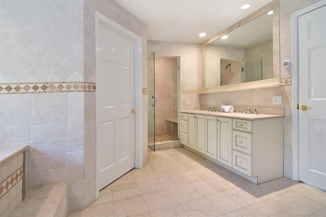668 Francis St, Pelham, NY 10803 - full bath with a sink, tile walls, a shower stall, marble finish floor, and recessed lighting