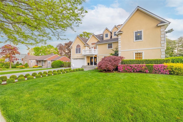 668 Francis St, Pelham, NY 10803 - view of front of house featuring concrete driveway, a front yard, stucco siding, and a garage