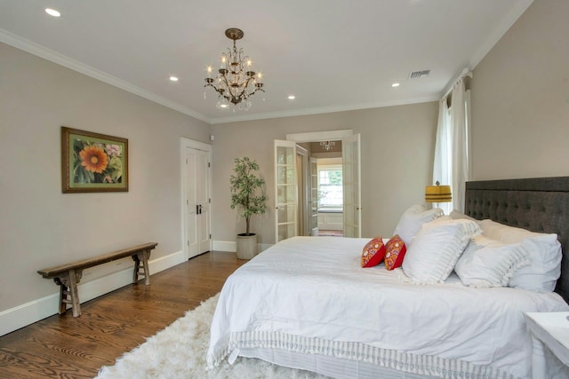 bedroom featuring a chandelier, wood finished floors, recessed lighting, crown molding, and baseboards