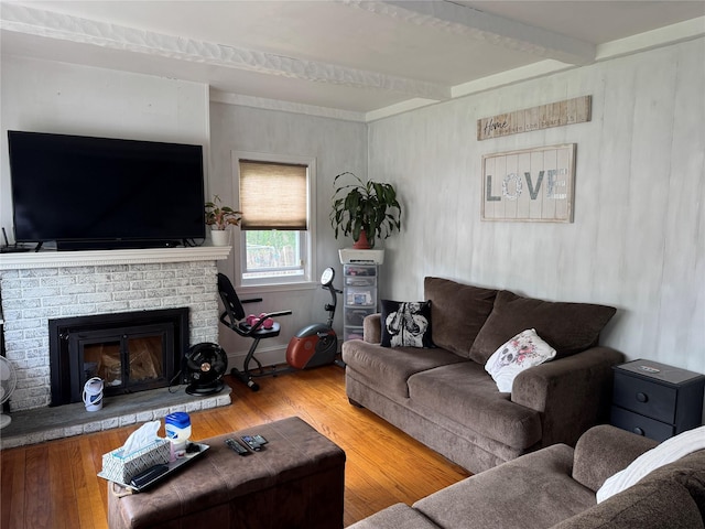5 W Stone St, Newburgh, NY 12550 - living area with wood finished floors, beamed ceiling, and a fireplace