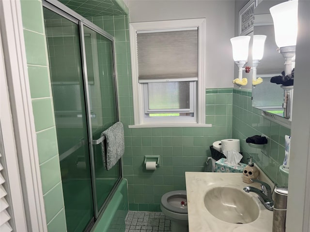 5 W Stone St, Newburgh, NY 12550 - bathroom featuring tile walls, toilet, enclosed tub / shower combo, and vanity