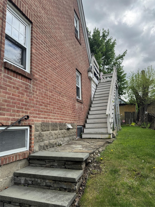 5 W Stone St, Newburgh, NY 12550 - view of home's exterior with stairway and brick siding