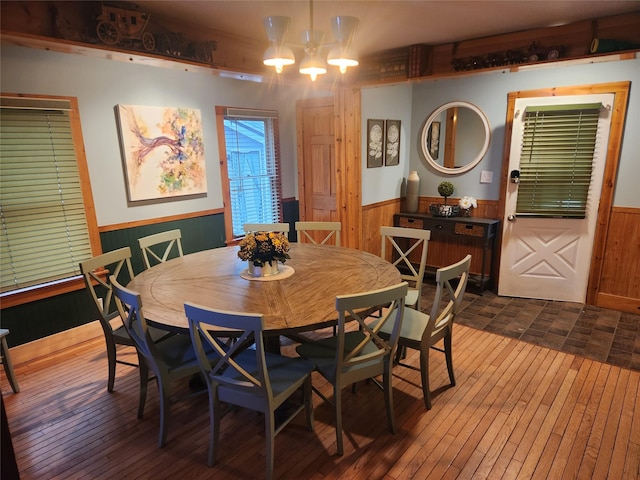 7181 County Highway 7, Roscoe, NY 12776 - dining space with a wainscoted wall, dark wood-type flooring, and wooden walls