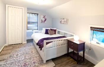 7181 County Highway 7, Roscoe, NY 12776 - bedroom featuring wood finished floors, lofted ceiling, and baseboards
