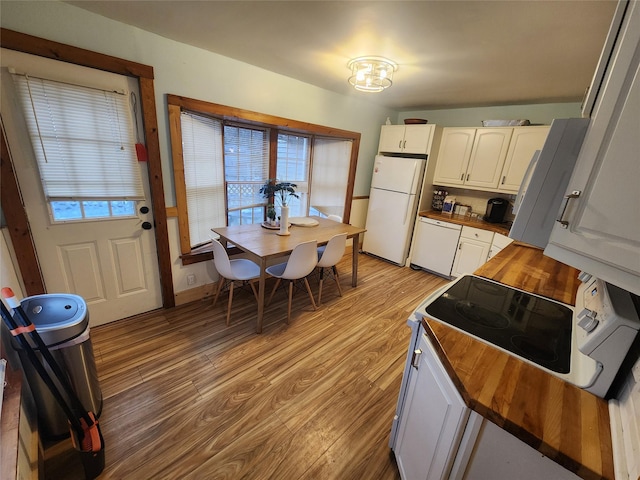 7181 County Highway 7, Roscoe, NY 12776 - kitchen with white appliances, wooden counters, light wood finished floors, white cabinets, and a chandelier