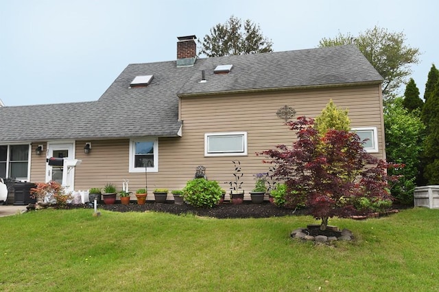 21 Potter Ln, Levittown, NY 11756 - back of house with a lawn, a chimney, and roof with shingles