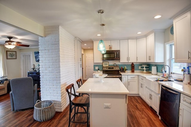 21 Potter Ln, Levittown, NY 11756 - kitchen featuring appliances with stainless steel finishes, a sink, white cabinetry, decorative backsplash, and recessed lighting