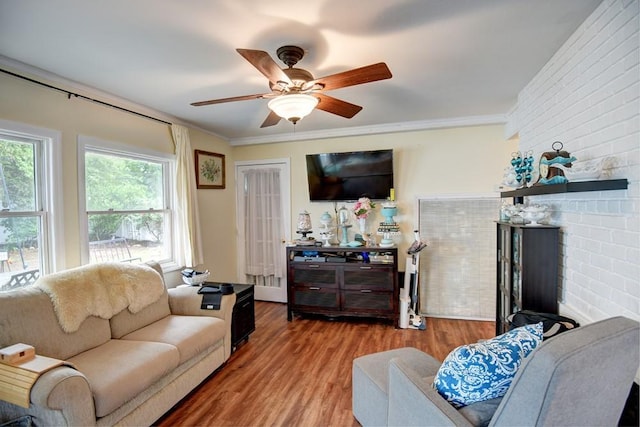 21 Potter Ln, Levittown, NY 11756 - living room with wood finished floors, ceiling fan, and crown molding