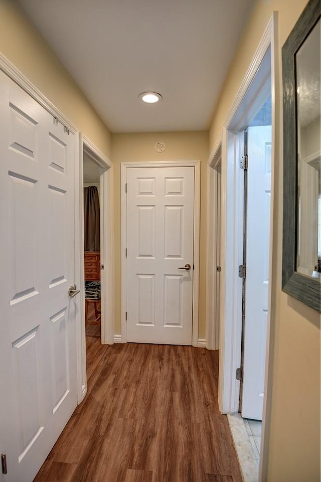 21 Potter Ln, Levittown, NY 11756 - hall with wood finished floors, recessed lighting, and baseboards