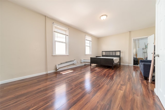 bedroom with baseboards, a baseboard radiator, and dark wood-style flooring
