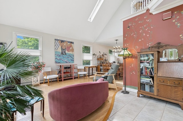 91 Soundview Dr, Rocky Point, NY 11778 - living area with high vaulted ceiling, a chandelier, a skylight, and light tile patterned floors