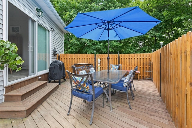 91 Soundview Dr, Rocky Point, NY 11778 - wooden deck with outdoor dining space, fence, area for grilling, and view of wooded area