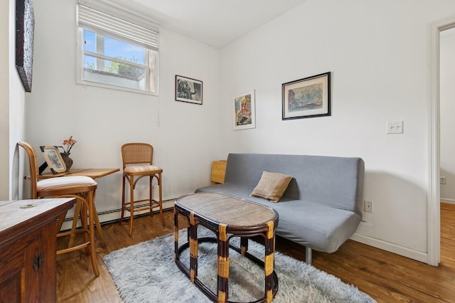 91 Soundview Dr, Rocky Point, NY 11778 - sitting room featuring wood finished floors, a baseboard radiator, and baseboards