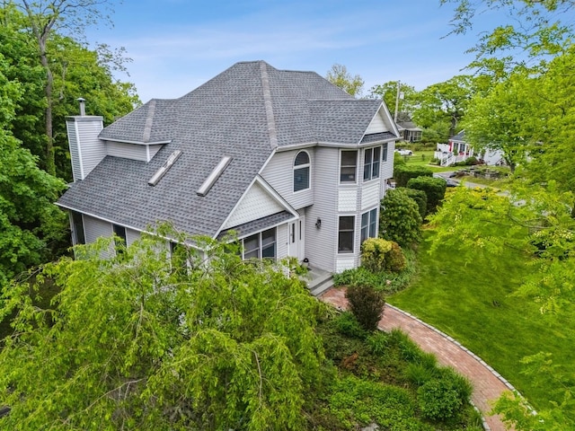 91 Soundview Dr, Rocky Point, NY 11778 - view of property exterior with a shingled roof and a chimney