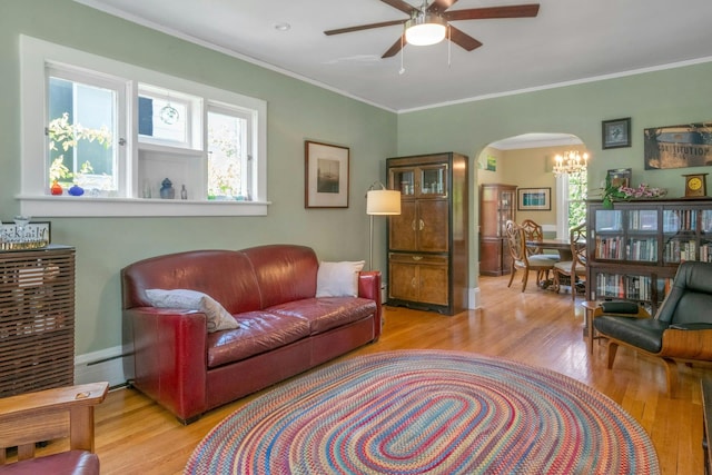 65 Hamilton Pl, Tarrytown, NY 10591 - living area with arched walkways, wood finished floors, a ceiling fan, baseboard heating, and ornamental molding