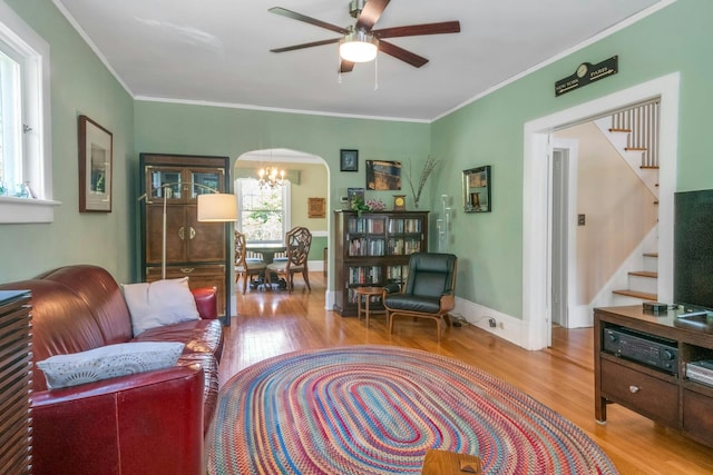 65 Hamilton Pl, Tarrytown, NY 10591 - living room with wood finished floors, stairs, plenty of natural light, and crown molding