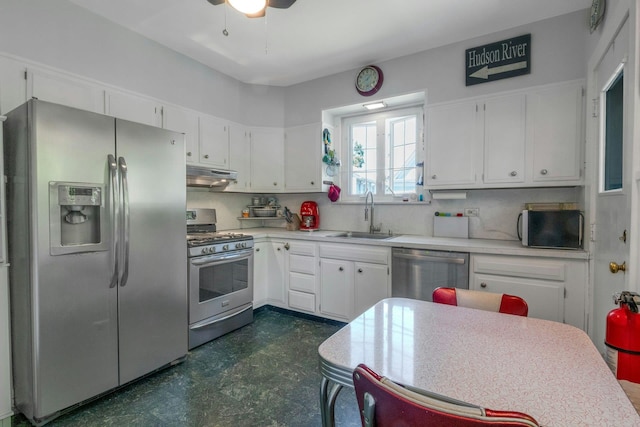 65 Hamilton Pl, Tarrytown, NY 10591 - kitchen featuring stainless steel appliances, a sink, under cabinet range hood, and white cabinetry