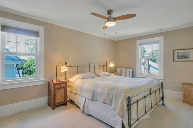 65 Hamilton Pl, Tarrytown, NY 10591 - bedroom with radiator heating unit, light carpet, baseboards, ceiling fan, and crown molding
