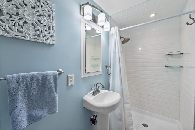 bathroom with a shower stall