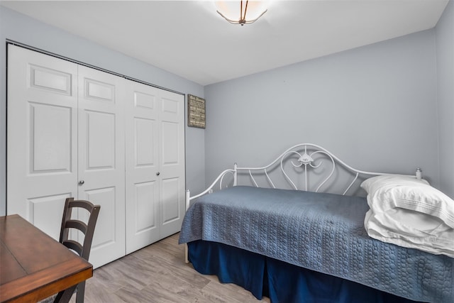 bedroom with a closet and wood finished floors
