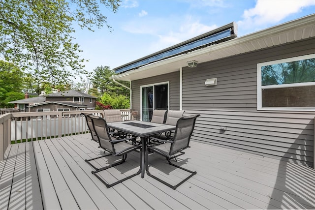 wooden deck featuring outdoor dining space