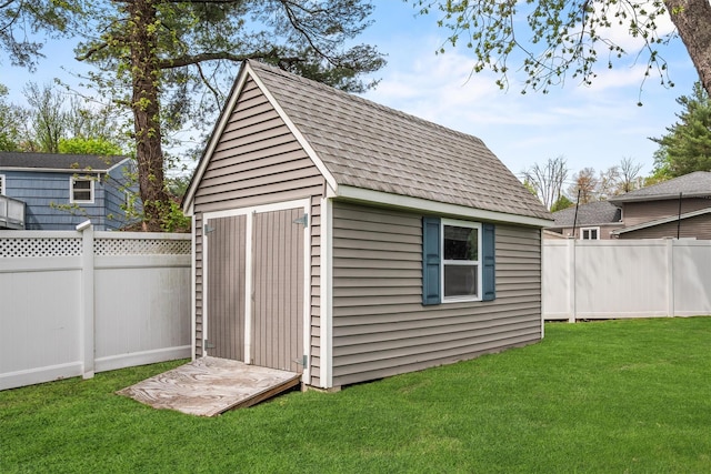 view of shed featuring a fenced backyard
