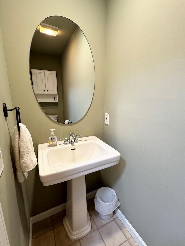 bathroom featuring tile patterned floors and baseboards
