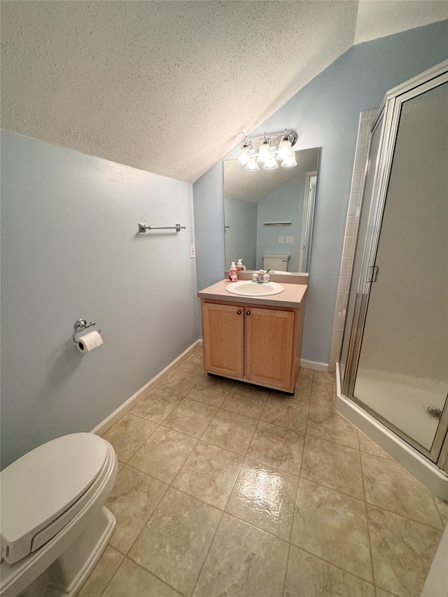 full bathroom with a textured ceiling, vaulted ceiling, a shower stall, vanity, and toilet