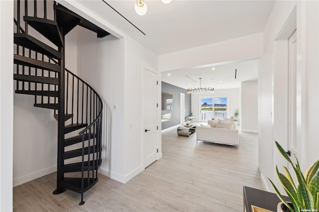 894 S Long Beach Ave, Freeport, NY 11520 - stairway featuring wood finished floors, recessed lighting, and a chandelier