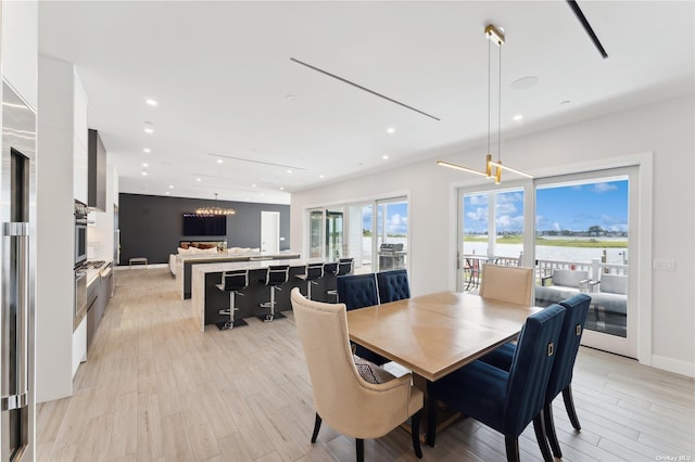 894 S Long Beach Ave, Freeport, NY 11520 - dining area with light wood-style flooring, a chandelier, and recessed lighting