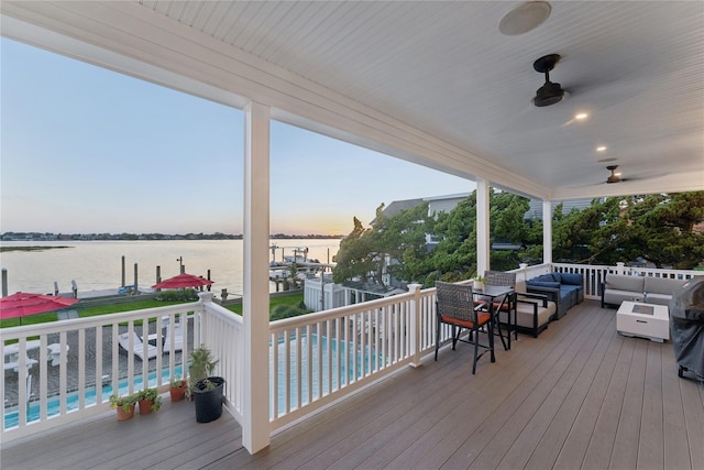 894 S Long Beach Ave, Freeport, NY 11520 - wooden deck featuring an outdoor hangout area, a water view, and a ceiling fan