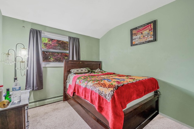 bedroom with a baseboard heating unit, carpet floors, and lofted ceiling