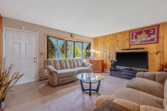 living room with light colored carpet, wooden walls, and baseboard heating