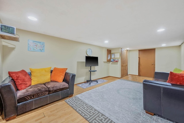 living room with recessed lighting and light wood-type flooring