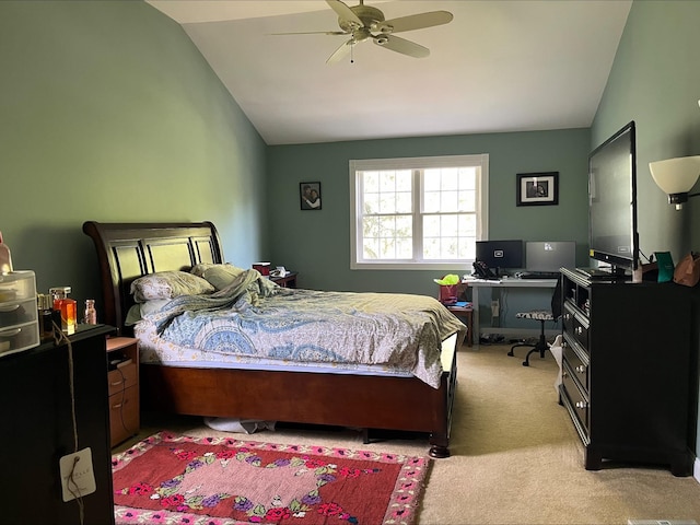 bedroom featuring lofted ceiling and light carpet
